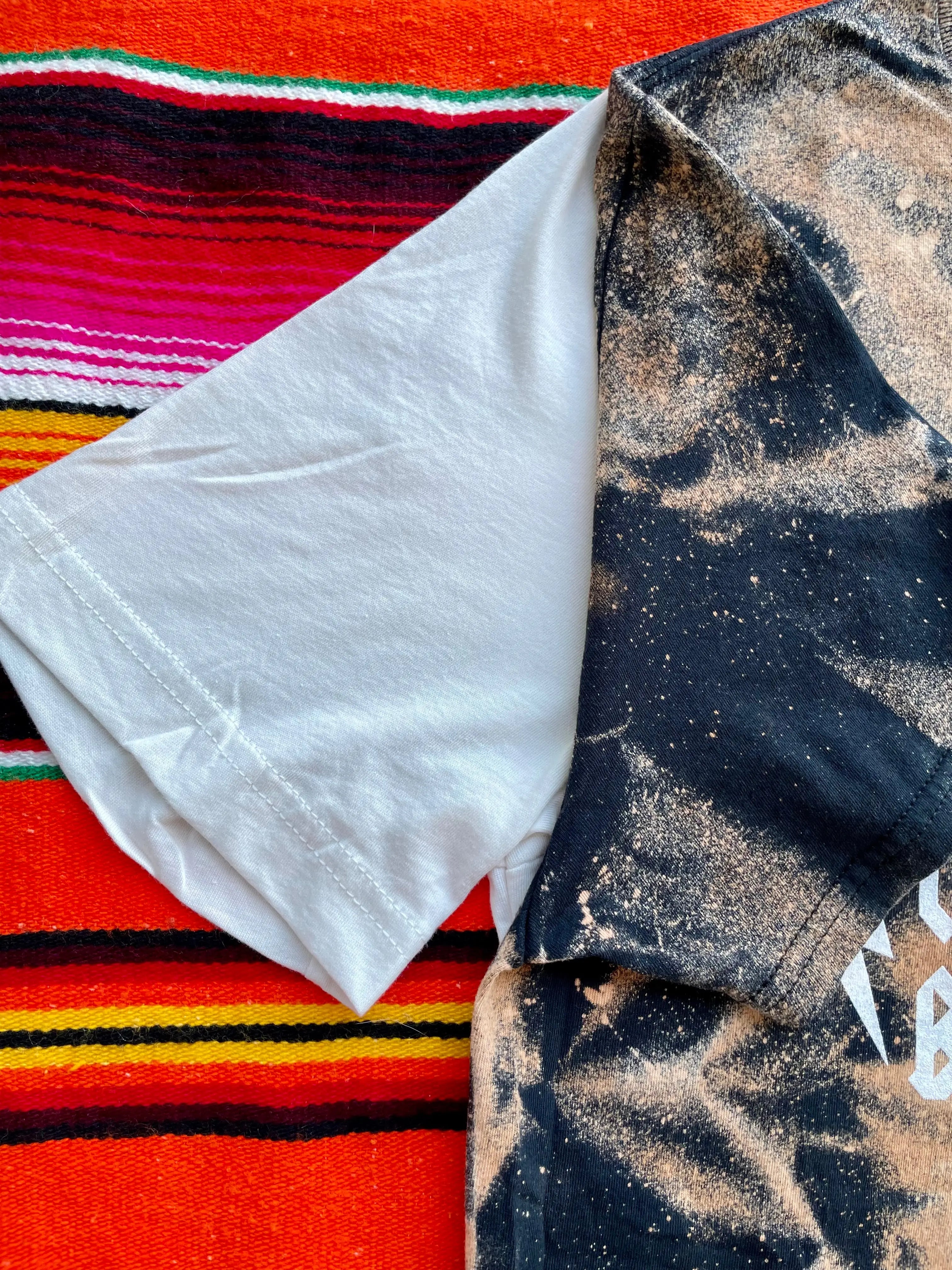 Faith‑inspired Western graphic tee with bleach stain rustic style sleeve view