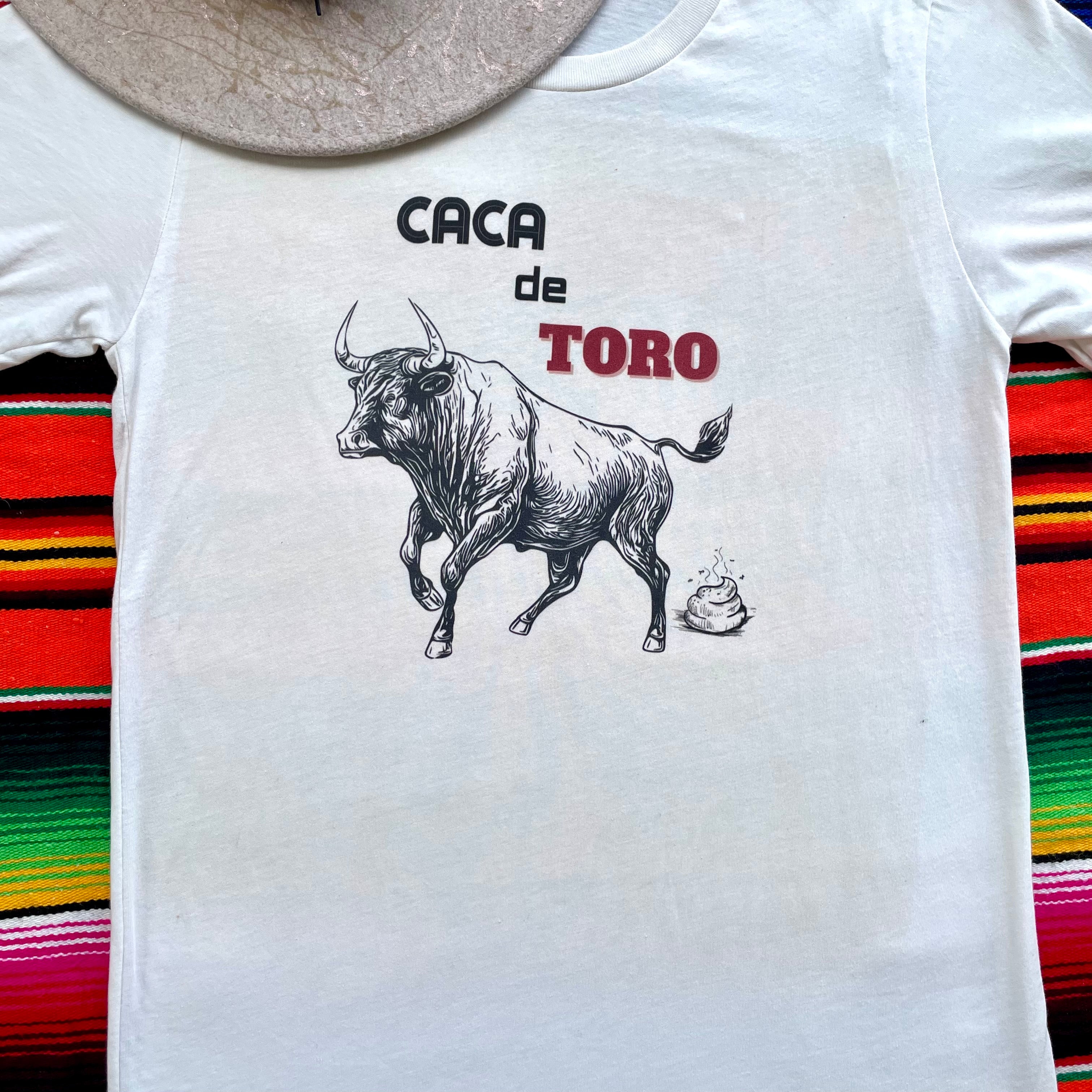 Antique White Bella+Canvas women’s graphic tee with western-inspired “CACA DE TORO” with bull graphic 