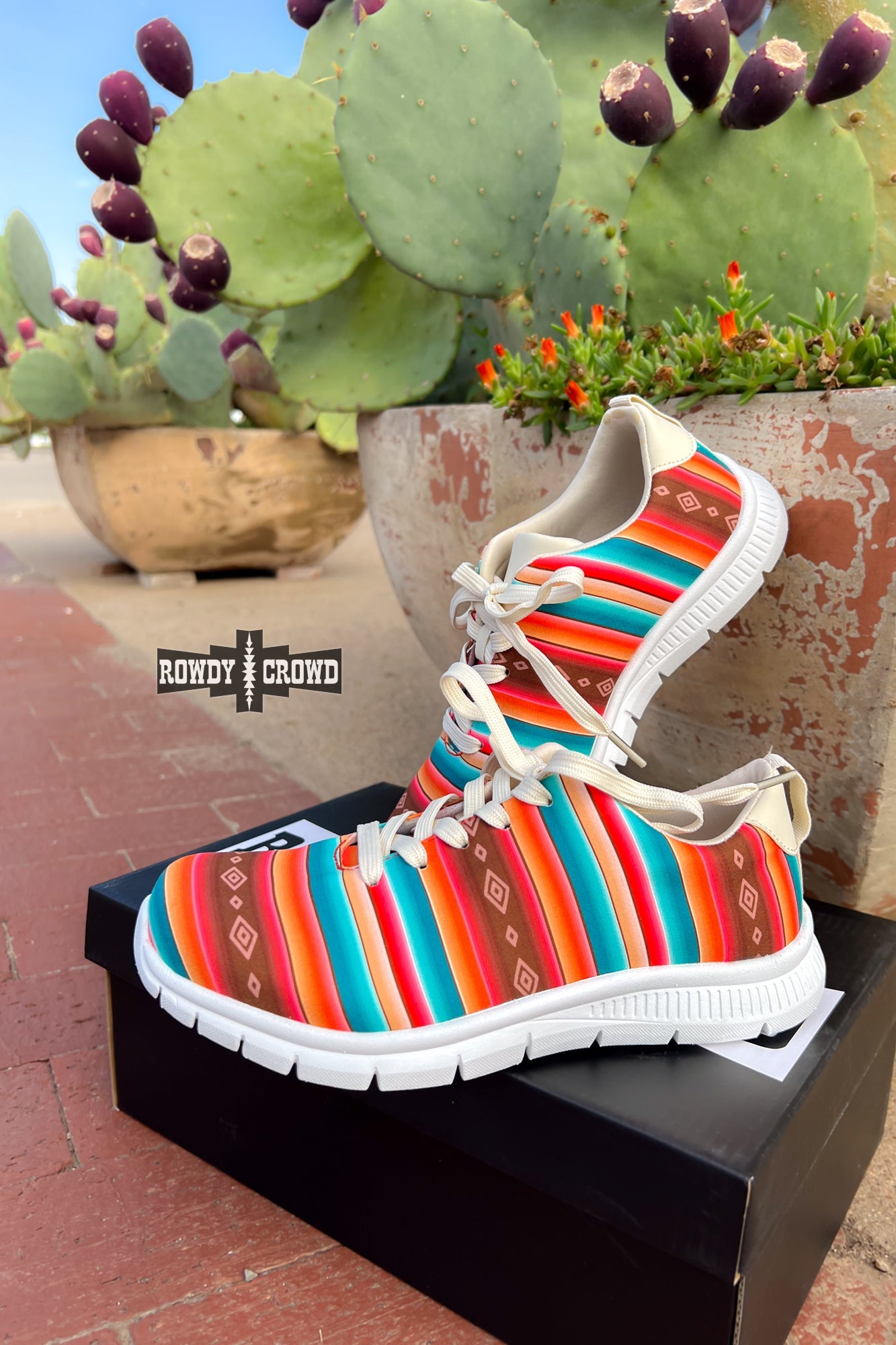 Rowdy Crowd western Seymour Serape Sneaker bright, colorful serape print with white sole.