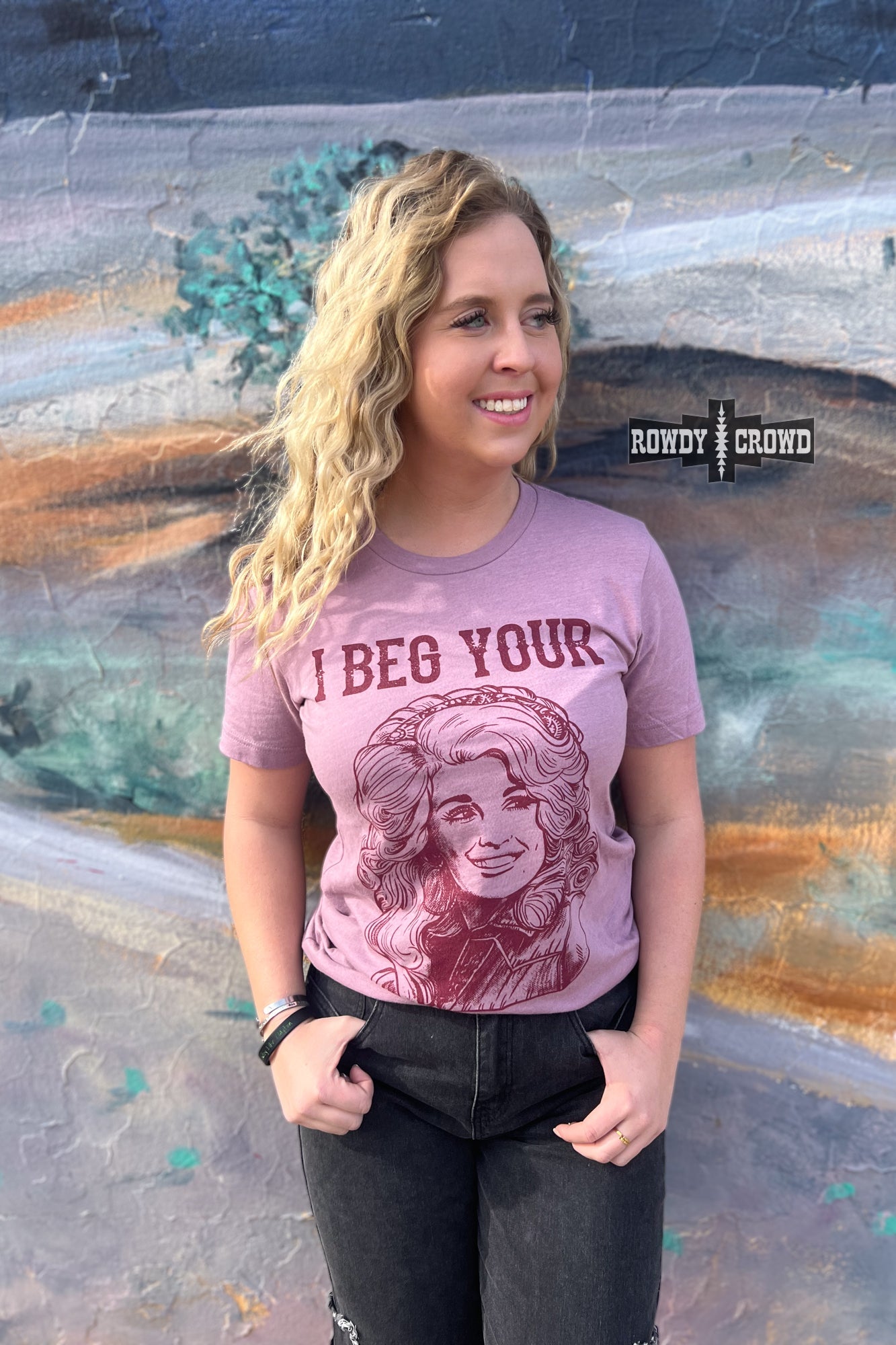 Rowdy Crowd I Beg Your Pardon Tee. Dolly Parton stretchy lightweight heather orchid tee screen print