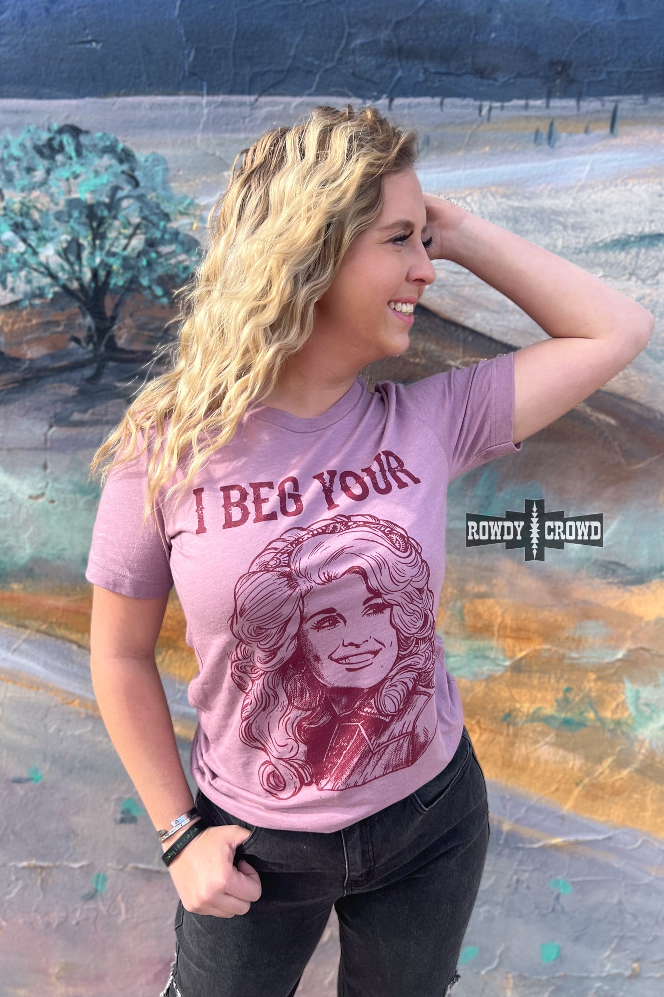 Rowdy Crowd I Beg Your Pardon Tee. Dolly Parton stretchy lightweight heather orchid tee screen print