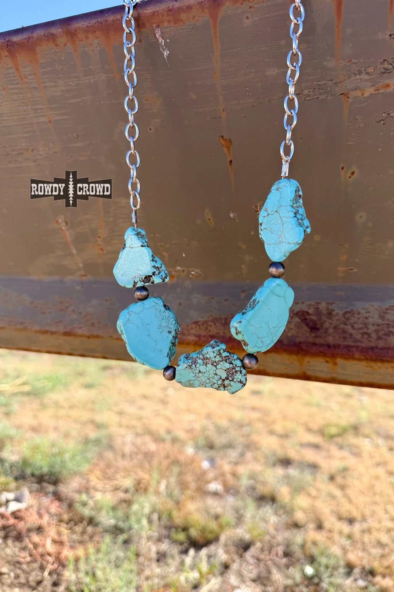 Western cowgirl jewelry necklace with unique turquoise stones and rugged silver chain