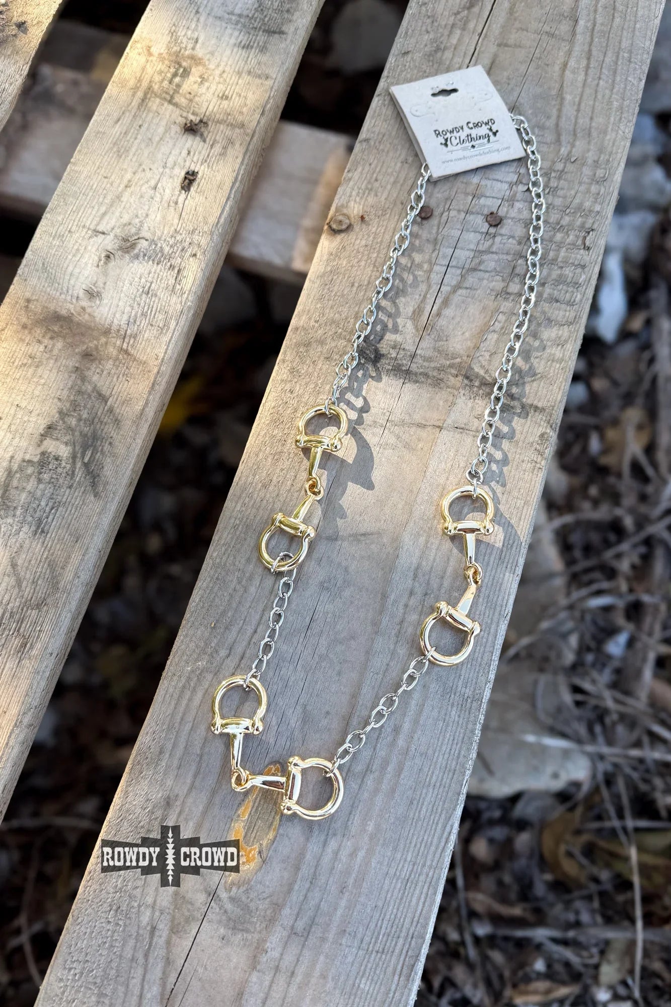 close up of mixed metal 3 bit necklace horse bit charms on chain western cowgirl accessory