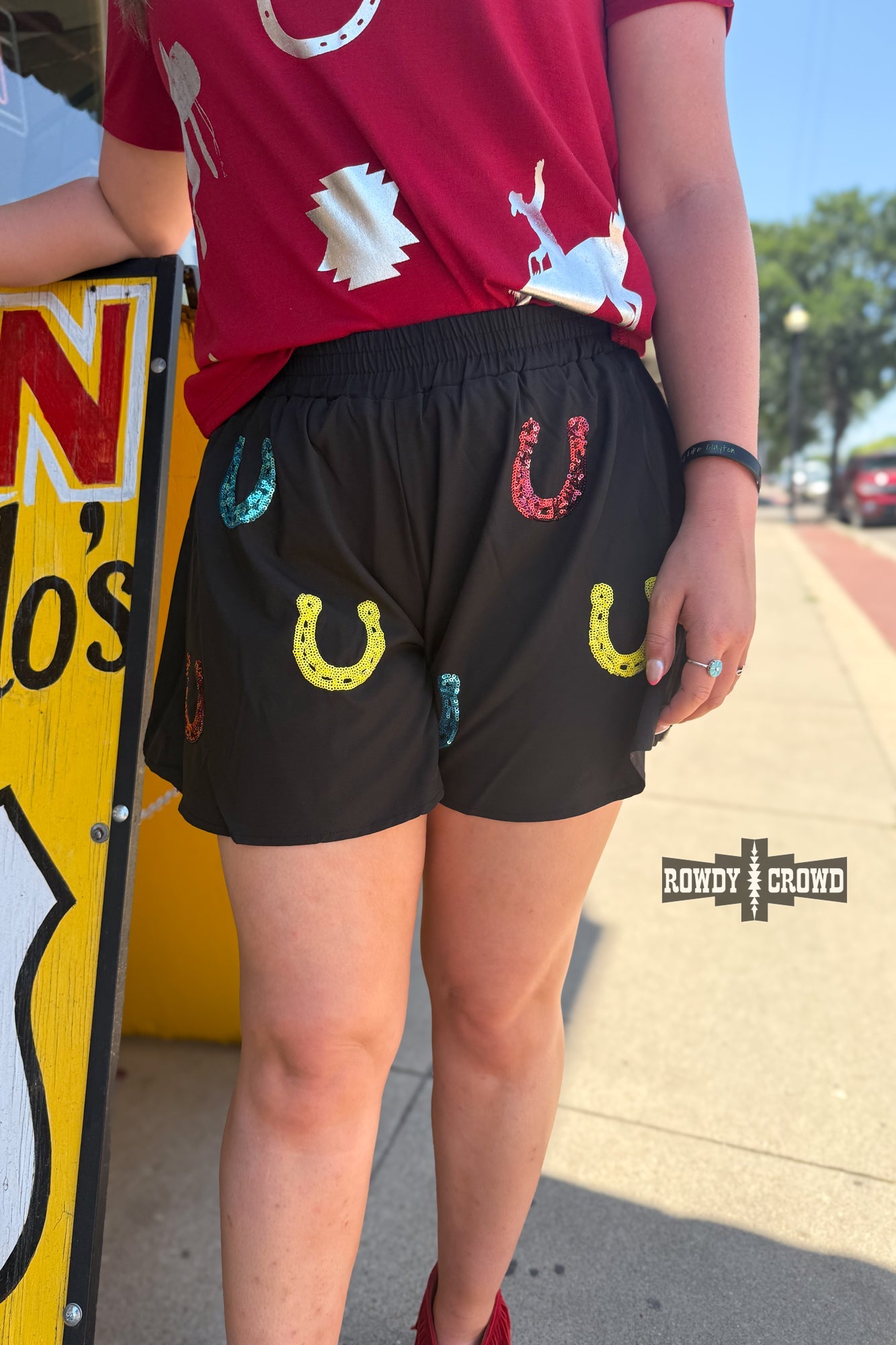 Rowdy Crowd Lucky Buck black shorts with colorful horseshoe designs