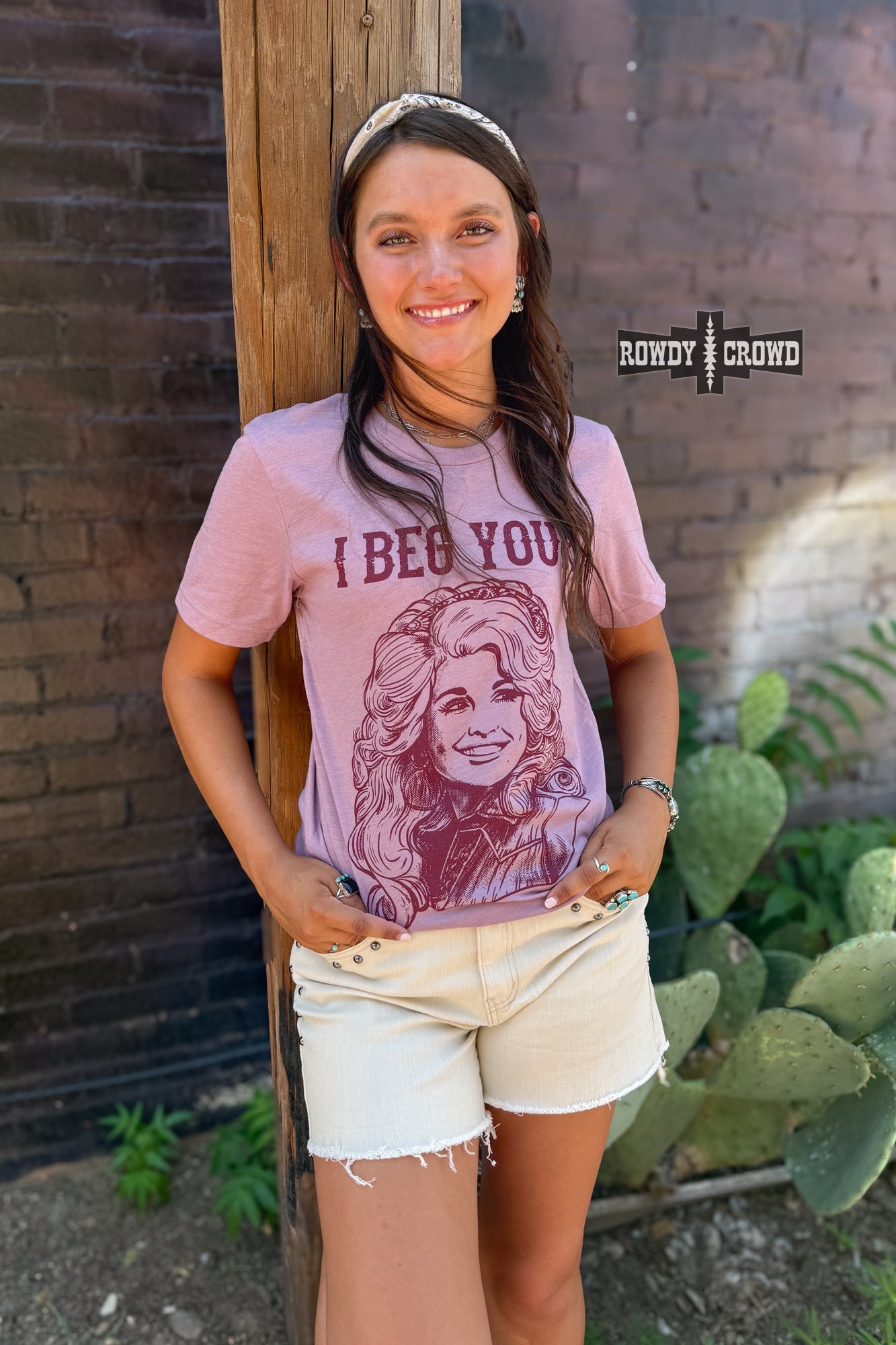 Rowdy Crowd I Beg Your Pardon Tee. Dolly Parton stretchy lightweight heather orchid tee screen print