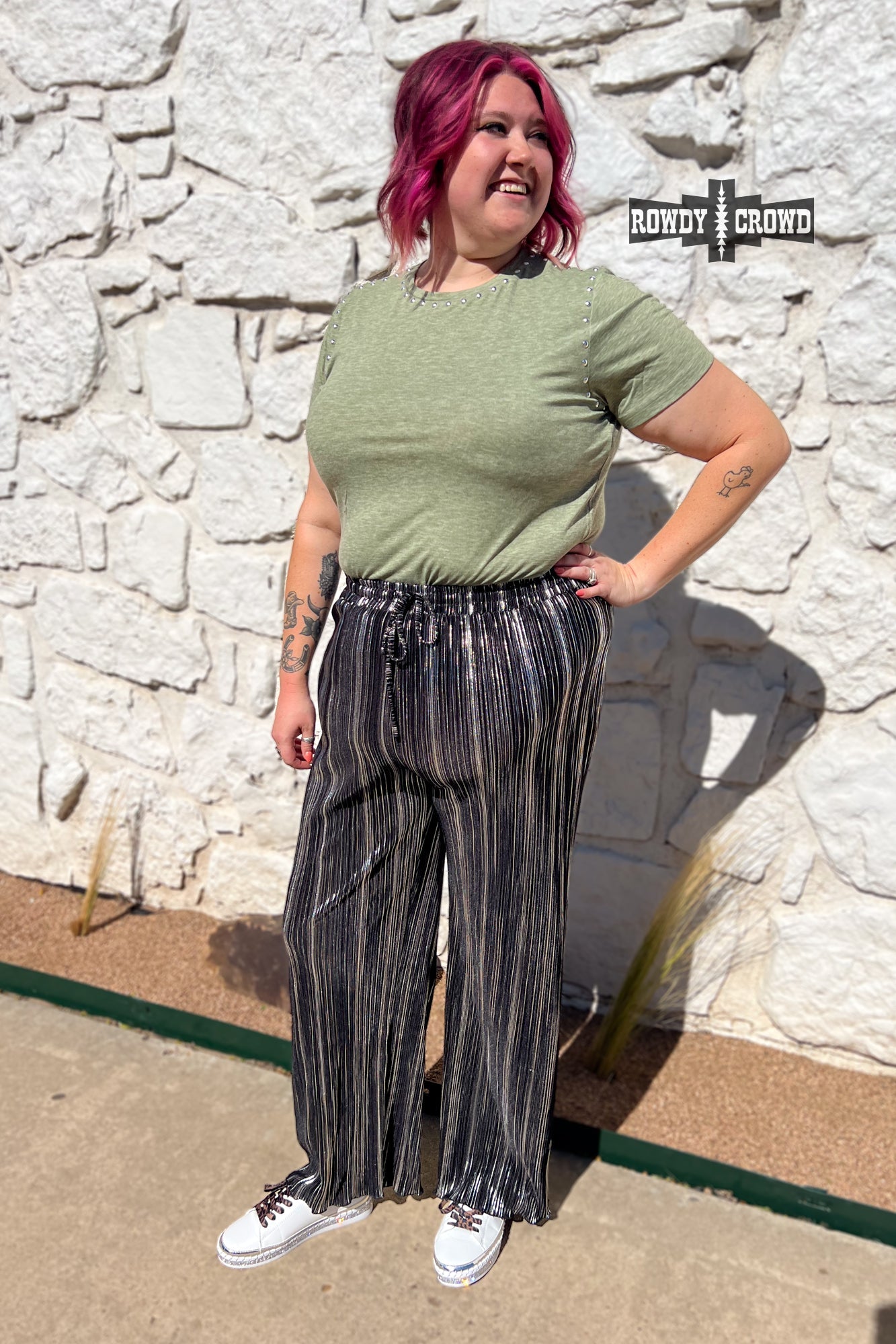Person wearing a graphic t-shirt and Rowdy Crowd Ruffled Cup wide leg striped pants 