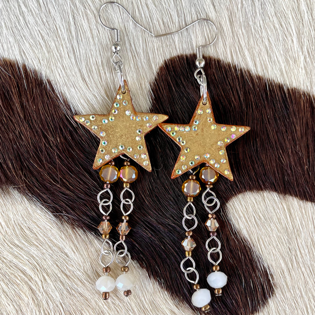 Golden leather star earrings with butterscotch hanging beads and rhinestone accents handmade western jewelry for cowgirls and rodeo fashion lovers