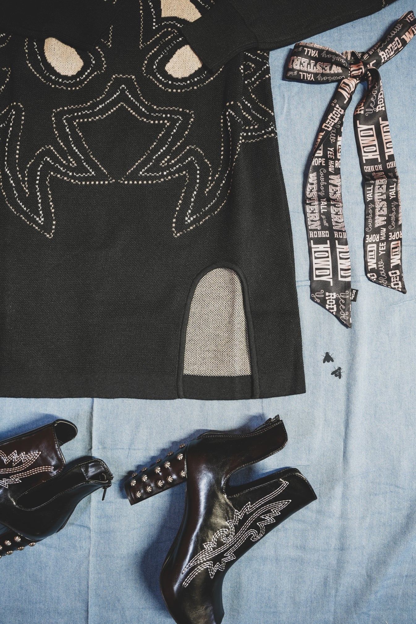 Black and beige patterned western style boot print dress with a cowboy hat