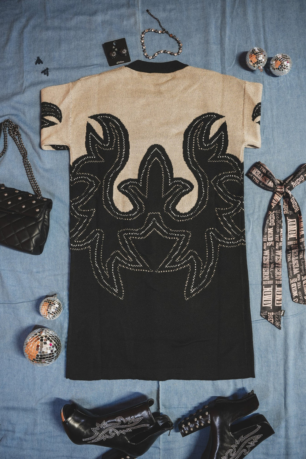 Black and beige patterned western style boot print dress with a cowboy hat