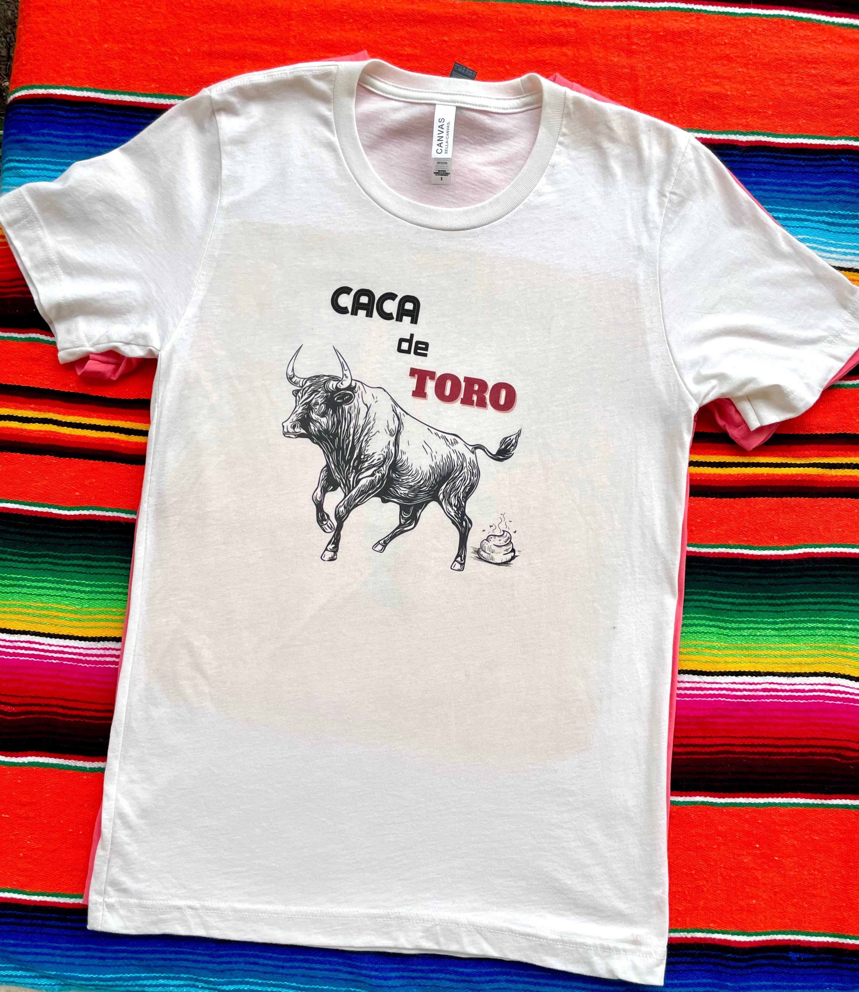 Pink cowgirl graphic t-shirt with "You Bet Your Watusi" slogan and illustrated by LHTX with a hand drawn Watusi bullhead western fashion apparel by the Bucktooth Horse
