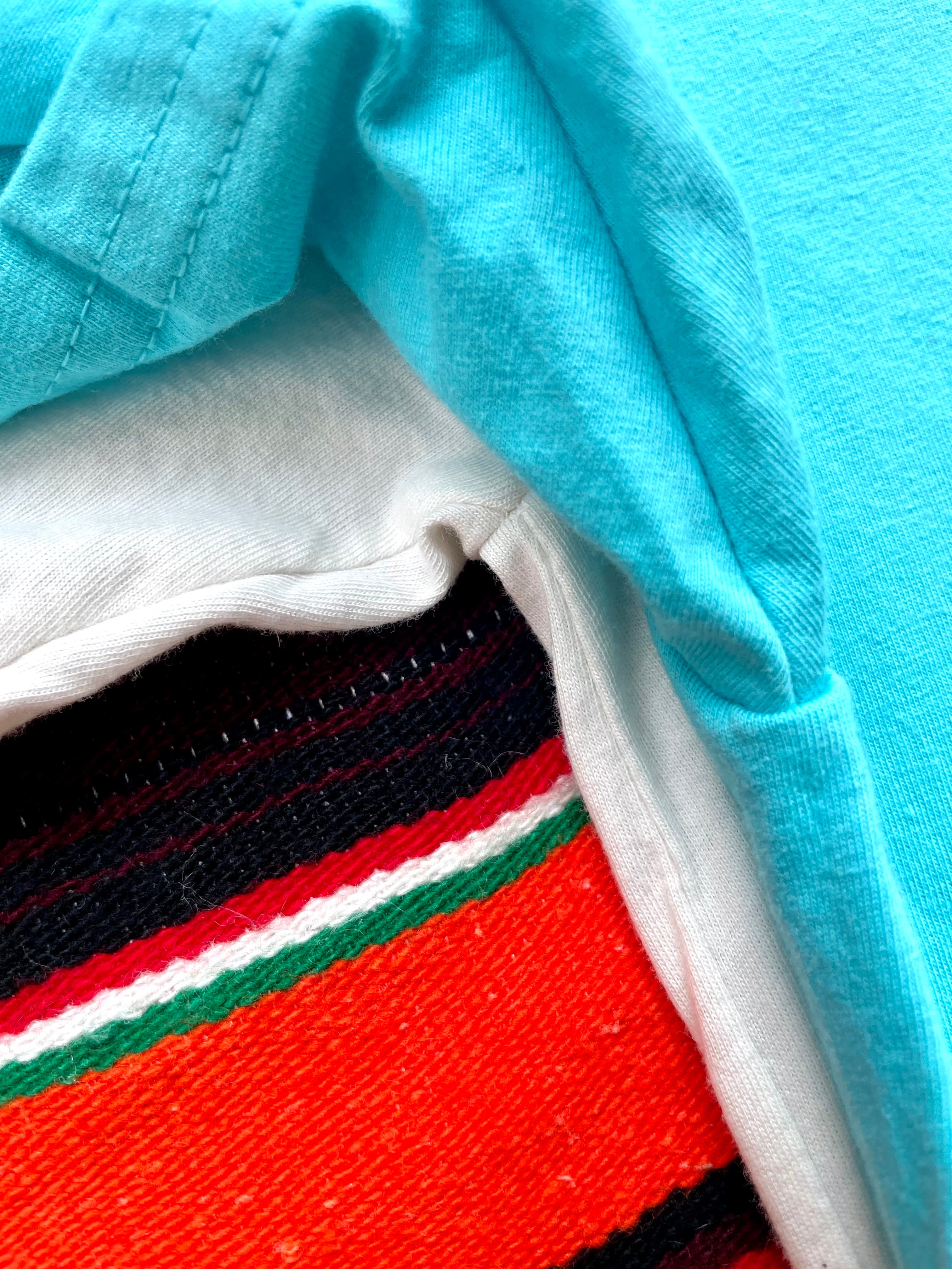 Close-up of a fabric with a striped pattern on a blue background