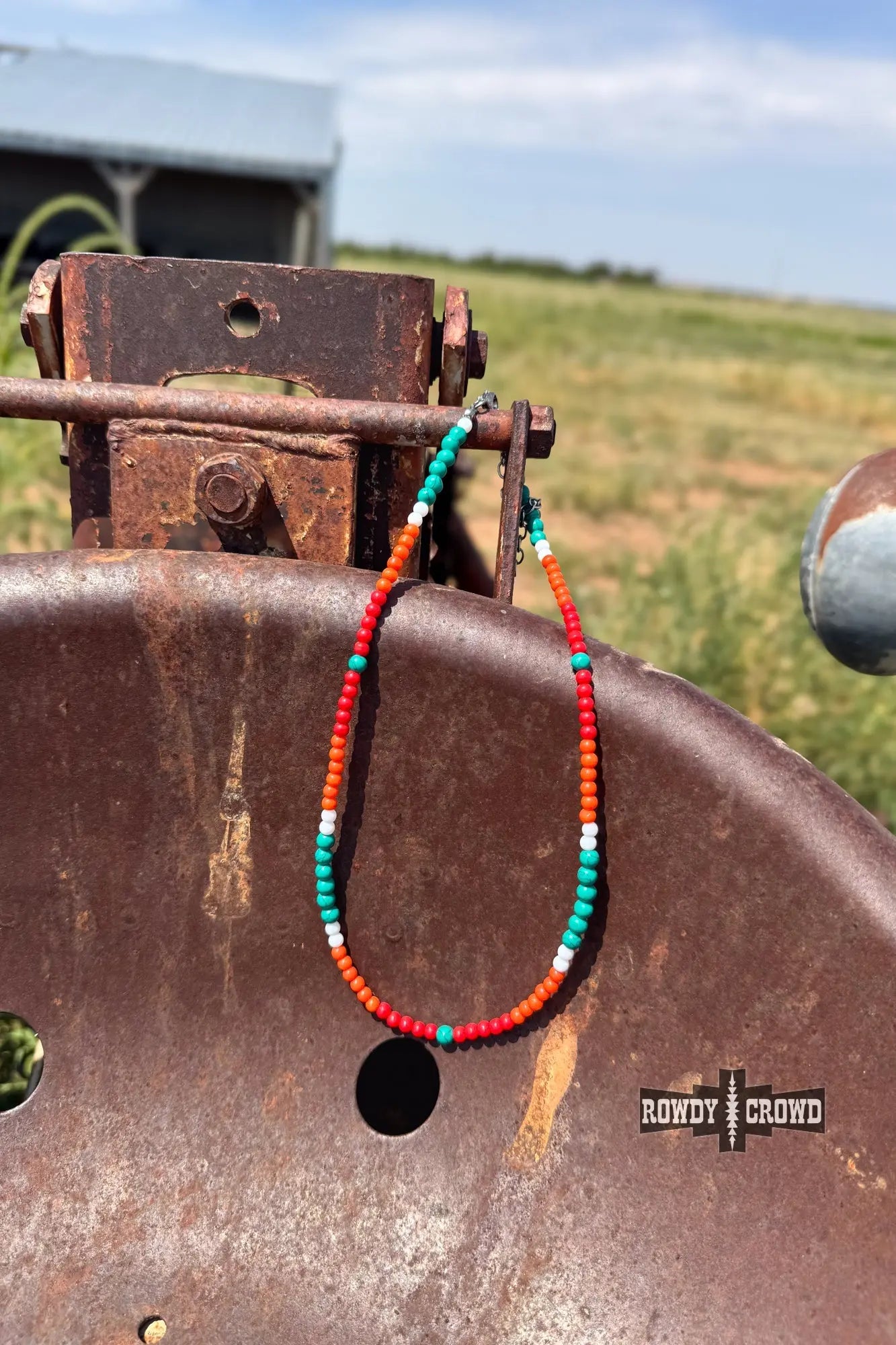 close up of sunshine ranch necklace fiery elegance turquoise orange white beads rustic western charm