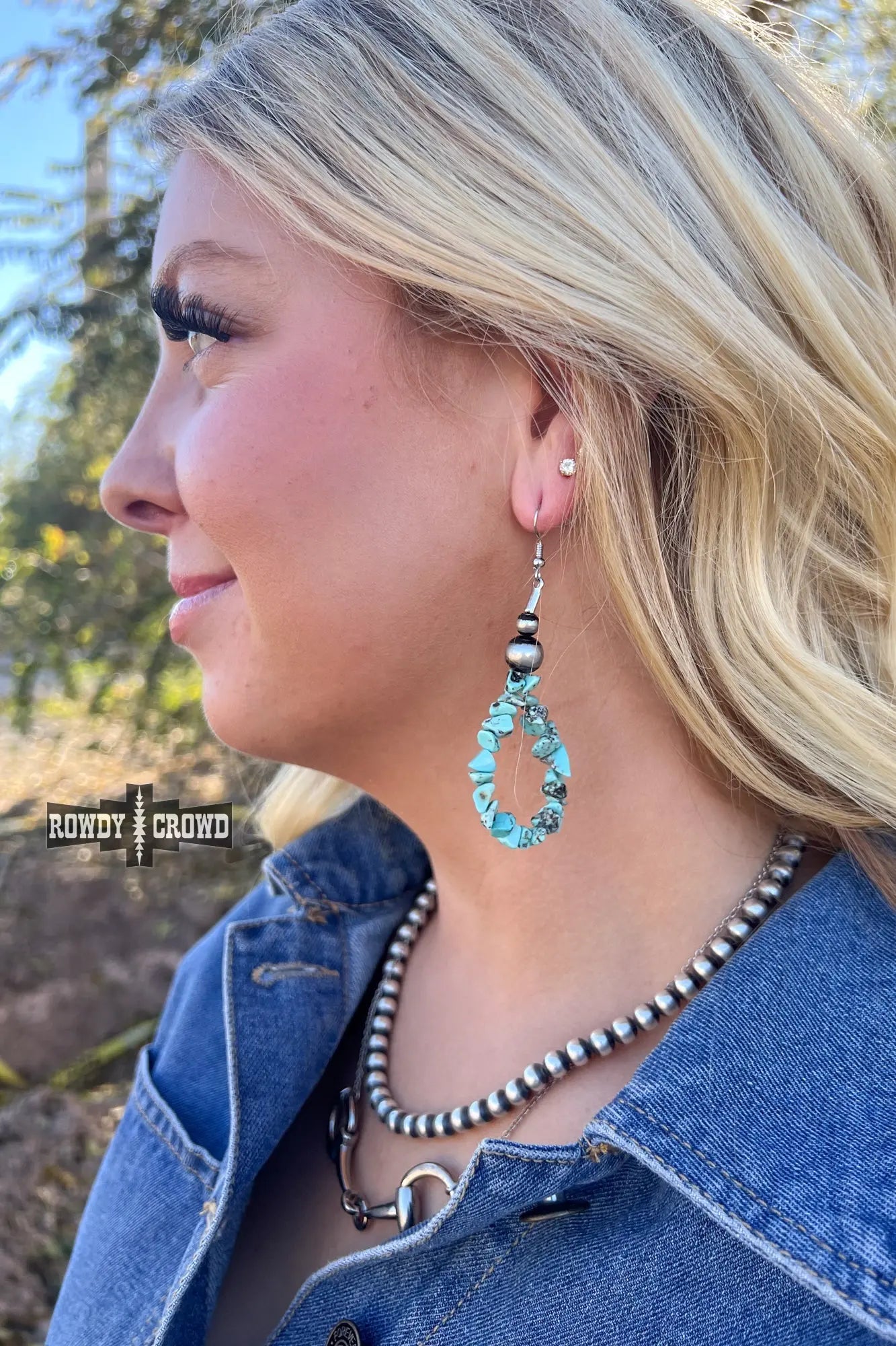 cowgirl wearing way out west earrings turquoise and silver western charm peaceful balanced empowering style
